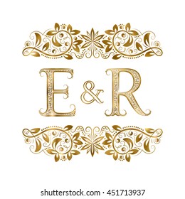 E and R vintage initials logo symbol. The letters are surrounded by ornamental elements. Wedding or business partners monogram in royal style.
