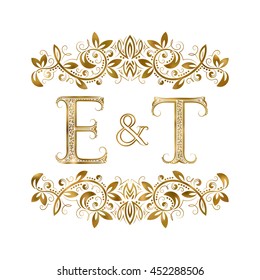 E and T vintage initials logo symbol. The letters are surrounded by ornamental elements. Wedding or business partners monogram in royal style.