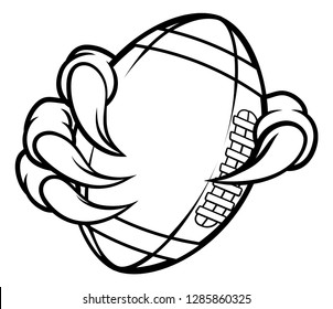 Eagle, bird or monster claw or talons holding an American football ball. Sports graphic.