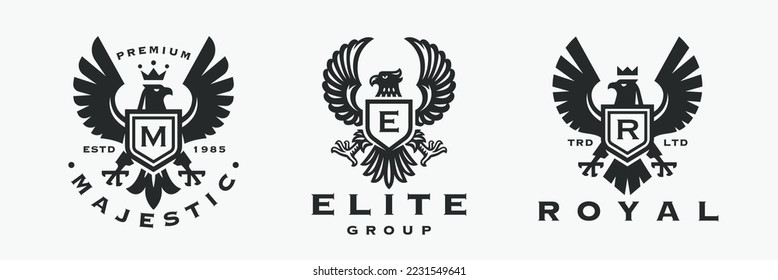 Eagle crest logo set. Heraldic flying falcon bird icons. Royal hawk shield monogram brand design label collection. Vector illustration.