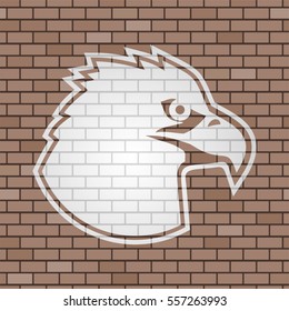 eagle face draw in brick wall