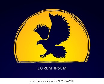 Eagle flying designed on moonlight background graphic vector.