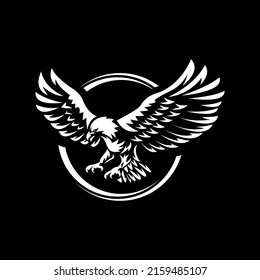 Eagle flying on dark background. Eagle Logo Template