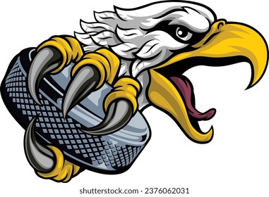 An eagle or hawk ice hockey puck cartoon sports team mascot