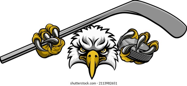 An eagle ice hockey player animal sports mascot holding hockey stick   puck