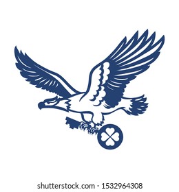 Eagle with a key in its paws. The bird carries a clover key in its paws.