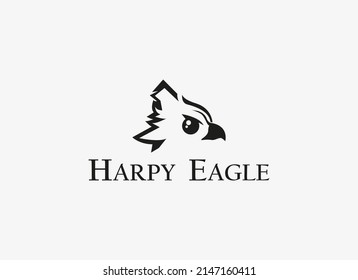 Eagle Logo. Black Geometric Shape Harpy Eagle Head isolated on White Background. Flat Vector Logo Design Template Element.