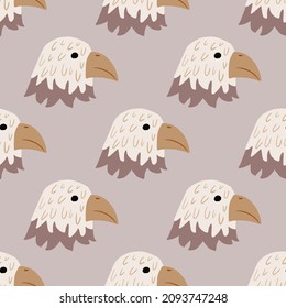 Eagle pattern seamless in freehand style. Head predator on colorful background. Vector illustration for textile prints, fabric, banners, backdrops and wallpapers.