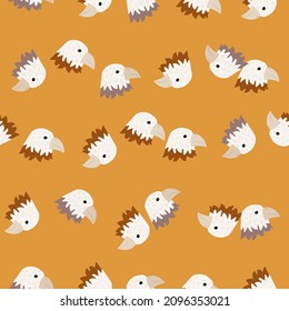 Eagle pattern seamless in freehand style. Head predator on colorful background. Vector illustration for textile prints, fabric, banners, backdrops and wallpapers.