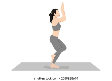 Eagle Pose, Beautiful girl practice Garudasana, Young attractive woman practicing yoga exercise. working out, black wearing sportswear, grey pants and top, indoor full length, calmness and relax.