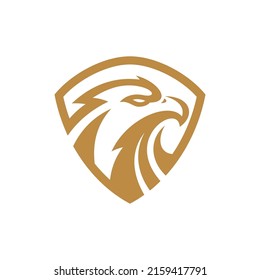 Eagle and shield logo design. Bird, falcon or hawk head badge emblem vector icon