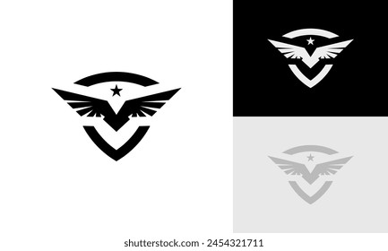 Eagle and shield logo design. Bird, falcon or hawk head badge emblem vector icon