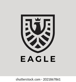 Eagle shield logo icon. Abstract hawk badge symbol. Phoenix bird emblem. Vector illustration.