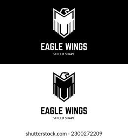 Eagle in shield shape wing logo design icon
