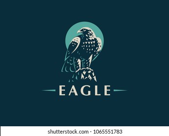 The eagle sits on a rock. Vector emblem.