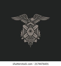 Eagle with spread wings holding vintage emblem with one eye on the center Vector Logo Illustration