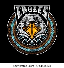 Eagle's head in center of motorcycle wheel, color label on black background