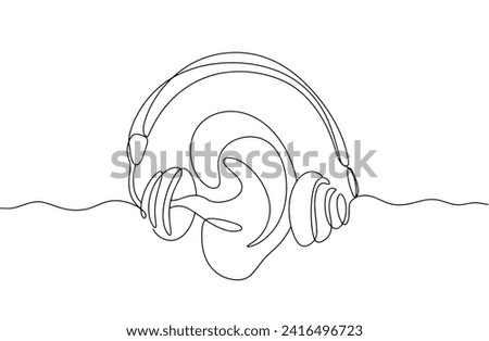 Ear inside audiometer headphones. Hearing diagnostic symbol. An instrument used to measure hearing ability. Images produced without the use of any form of AI software at any stage. 