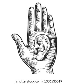 Ear on human hand palm sketch sketch engraving vector illustration. Scratch board style imitation. Black and white hand drawn image.