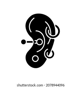 Ear piercing black glyph icon. Jewellery injected into human ears. Accessories made from valuable materials. Body modifications. Silhouette symbol on white space. Vector isolated illustration