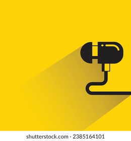 earphone with shadow on yellow background