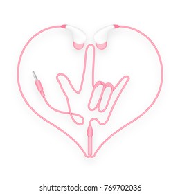 Earphones, In Ear type pink color and I Love You hand sign language with heart shape frame made from cable isolated on white background, with copy space