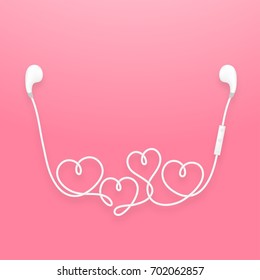 Earphones wireless and remote, earbud type white color and heart symbol made from cable isolated on pink gradient background, with copy space