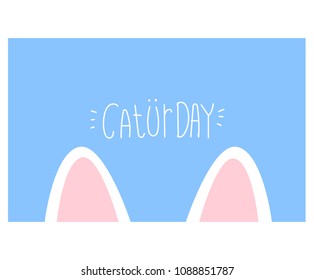 the ears of a cat, over blue background,cute greeting card cat with text"caturday"