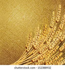 Ears of wheat on burlap background