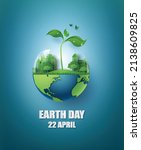 Earth Day paper cut art featuring a globe with plant and city for sustainability message.