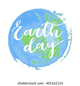 Earth day white hand written inscription on green and blue round watercolor background