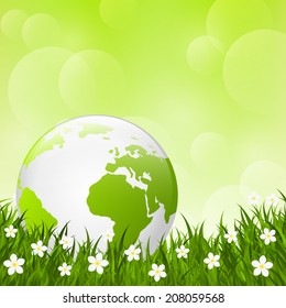 Earth globe on green grass
