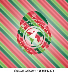 earth icon inside christmas colors style badge.