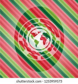 earth icon inside christmas emblem.