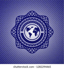 earth icon inside emblem with jean background