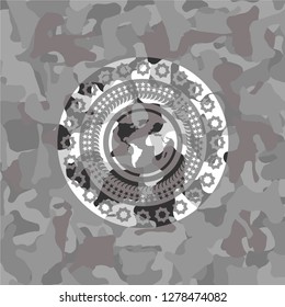 earth icon inside grey camouflage texture