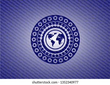 earth icon inside jean or denim emblem or badge background