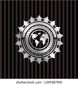 earth icon inside silver badge or emblem