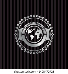 earth icon inside silver badge or emblem