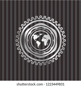 earth icon inside silver emblem or badge
