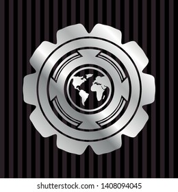 earth icon inside silver emblem or badge