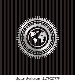 earth icon inside silver emblem. 