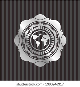 earth icon inside silvery emblem or badge