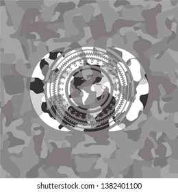 earth icon on grey camouflage pattern