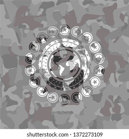 earth icon on grey camouflaged pattern