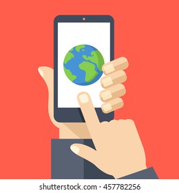 Earth icon on smartphone screen. Hand holding smartphone, finger touching screen. GPS navigation, traveling. Modern elements for web sites, web banners, infographics. Flat design vector illustration