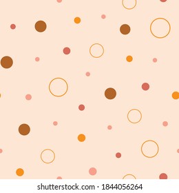 Earth tones dots and circles seamless repeat pattern. Hand-drawn dots and circles in different sizes, vector illustration.