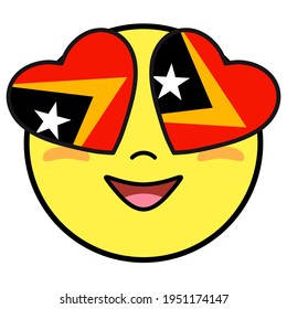 East Timor flag button. Patriotic smile in hearts glasses. Emoji icon isolated on white background.