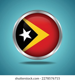 The East Timor flag. Round glossy. Silver frame. Isolated on color gradient background