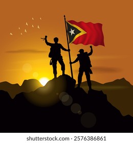 East Timor flag, silhouette of two climbers holding flags at sunset
